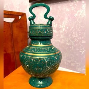 Elinora’s brass and patina, hand carved, polished small pet urn.